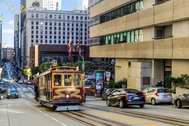 A view down our street showing a cable car on the left and city view on the right