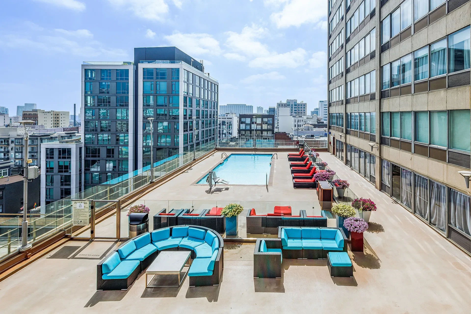 Our roof top pool and sun deck sitting area, showing lounge chairs and pool lift.